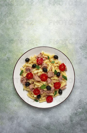 Tuna salad, fusilli pasta, olives and cherry, olive oil, homemade