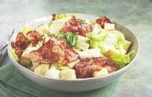 Caesar salad with fried bacon, quail eggs, homemade, no people