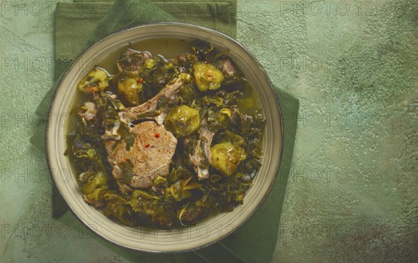Chakapuli, Georgian dish, stewed meat with herbs and tkemali, in white wine, homemade, no people