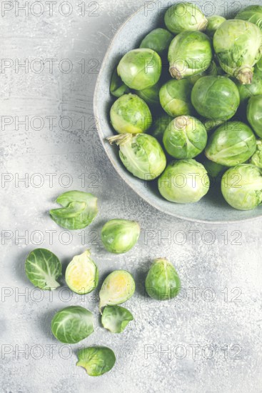 Fresh Brussels sprouts, raw, top view, on a gray table, no people