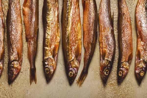 Cold smoked capelin, on the table, top view, no people