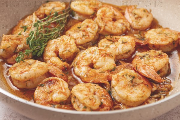 Shrimp dish cooked, in savory sauce. with fragrant herbs, and spices