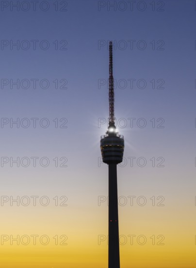 Details of an illuminated television tower at sunrise with a purple sky, Stuttgart, Baden-Württemberg, Germany