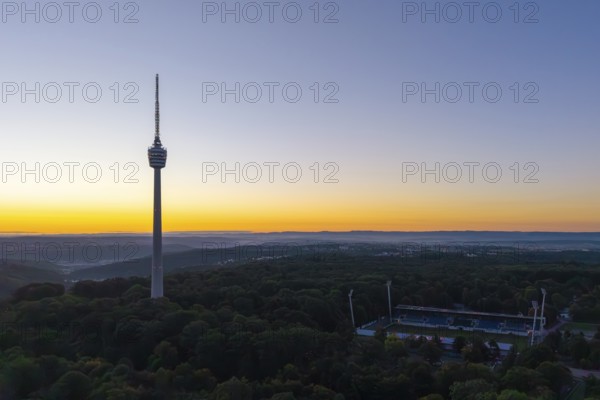 Expansive landscape with television tower and forests in the evening light of sunrise, Stuttgart, Baden-Württemberg, Germany