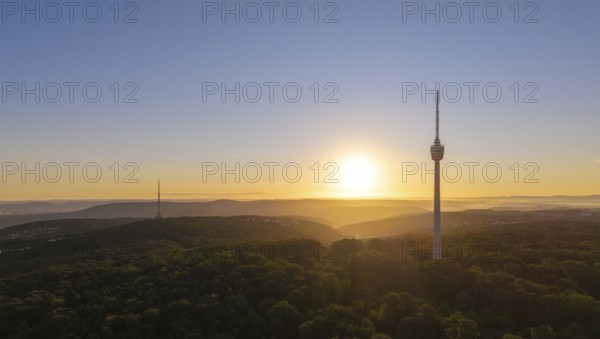 Atmospheric landscape with television tower and forest at sunrise, quiet atmosphere, Stuttgart, Baden-Württemberg, Germany