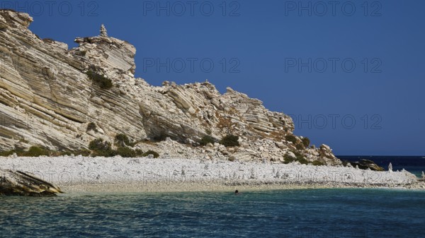 Rocky coastal landscape with a clear blue sky and calm turquoise water, White Cliffs, White Beach, Makri Aspronisi Island, Natura 2000 area, boat trip, Aspronisi, Lipsi, Dodecanese, Greek Islands, Greece