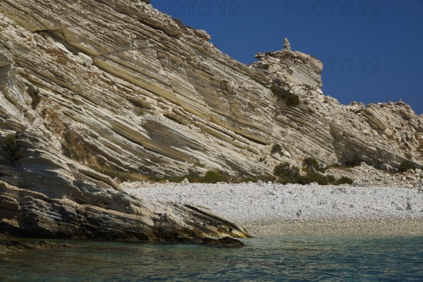 Rock formations over a calm turquoise sea with a clear sky above, White Cliffs, White Beach, Makri Aspronisi Island, Natura 2000 area, boat trip, Aspronisi, Lipsi, Dodecanese, Greek Islands, Greece