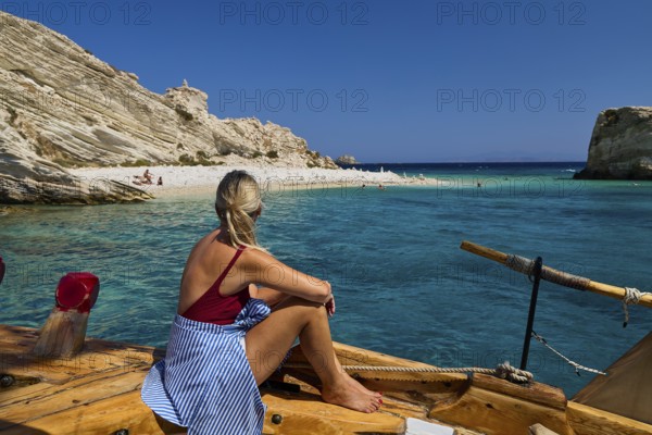 Woman sitting on a boat looking at the calm, turquoise-coloured seascape, White Cliffs, White Beach, Makri Aspronisi Island, Natura 2000 area, boat trip, Aspronisi, Lipsi, Dodecanese, Greek Islands, Greece