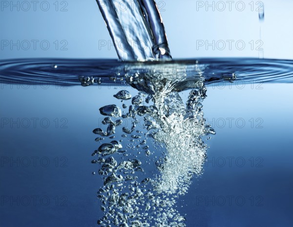 High-quality image showing a splash of water pouring into a clean surface, symbolizing freshness, purity, and energy, perfect for concepts like hydration or environmental awareness, AI generated