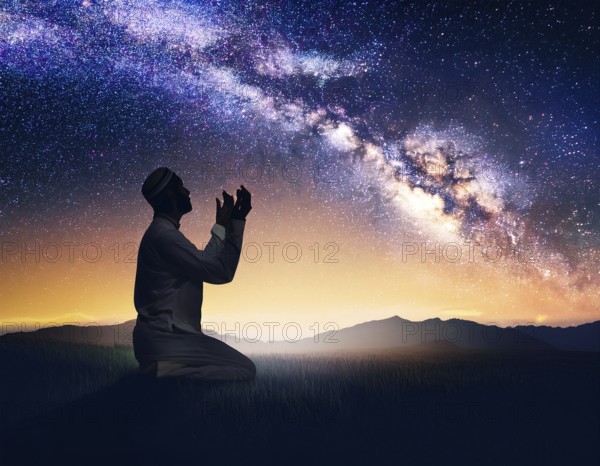 A man kneels in peaceful reflection under the vibrant Milky Way galaxy at sunset in an open natural setting, making prays, AI generated