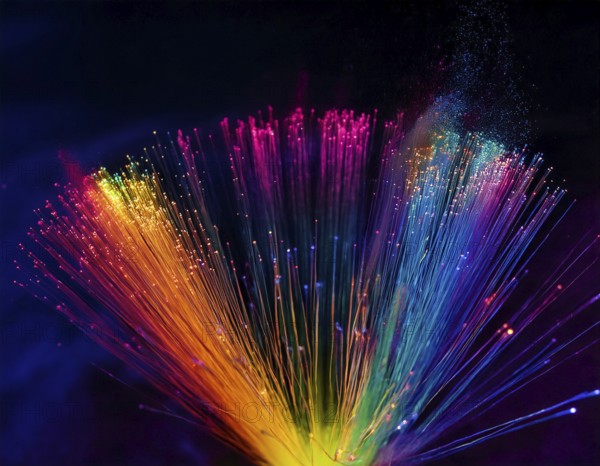 Glowing fiber-optic lights in vivid colors, creating a futuristic and dynamic visual effect, ideal for technology, AI generated