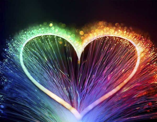 Colorful artistic display featuring vibrant light patterns shaped like a heart, expressing love and creativity through illuminated fibers in a mesmerizing spectrum of rainbow hues, AI generated
