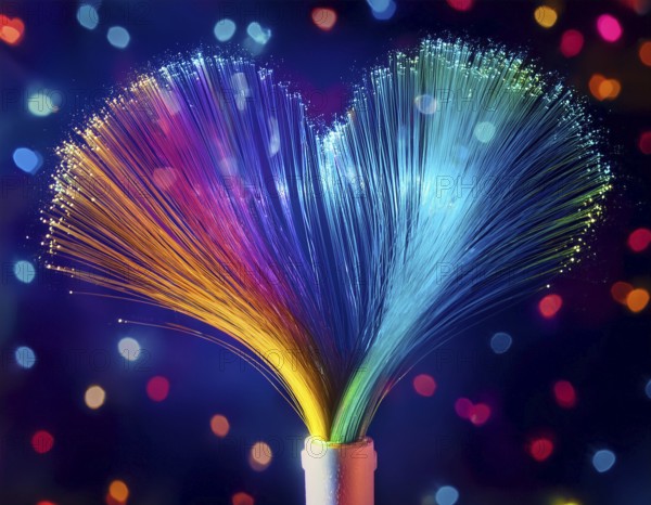 Colorful artistic display featuring vibrant light patterns shaped like a heart, expressing love and creativity through illuminated fibers in a mesmerizing spectrum of rainbow hues, AI generated