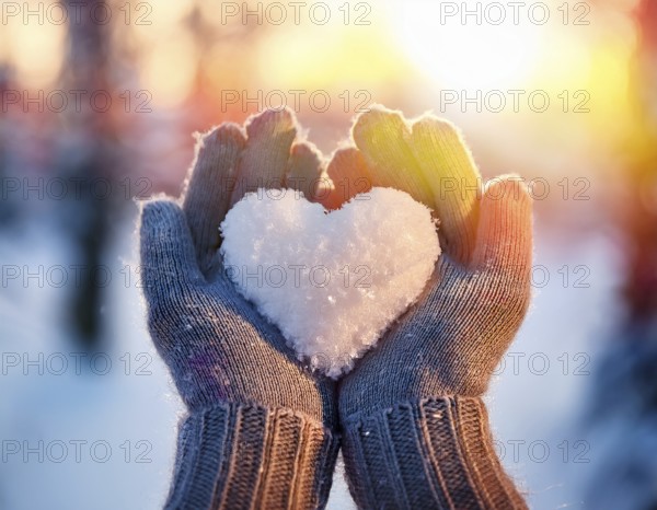Serene winter scene showcasing hands in gloves holding a snow heart symbolizing love and warmth, AI generated