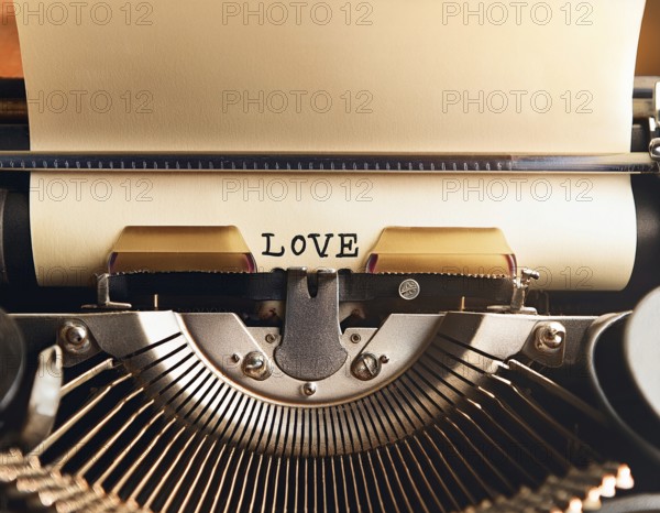 View from above of a retro typewriter equipped with 'love' word paper sheet, representing creativity, literary work, and nostalgia for traditional written communication methods, AI generated