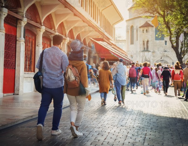 Travelers walk through an scanic architecture and culture of Muslim country, AI generated