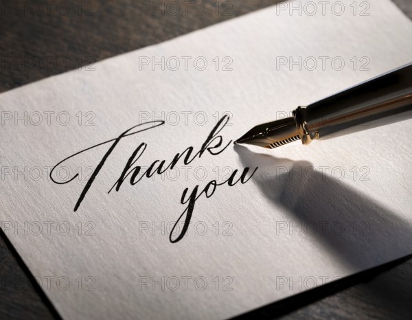 Elegant pen rests alongside a handwritten Thank You card on a wooden surface in soft light. Emphasizing gratitude, personal touch, and communication through traditional methods, AI generated