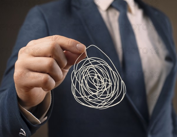 A close-up of a professional ipresenting a piece of intricate, tangled wire, symbolizing complexity, solution-finding, and creative problem-solving in a business or conceptual context, AI generated