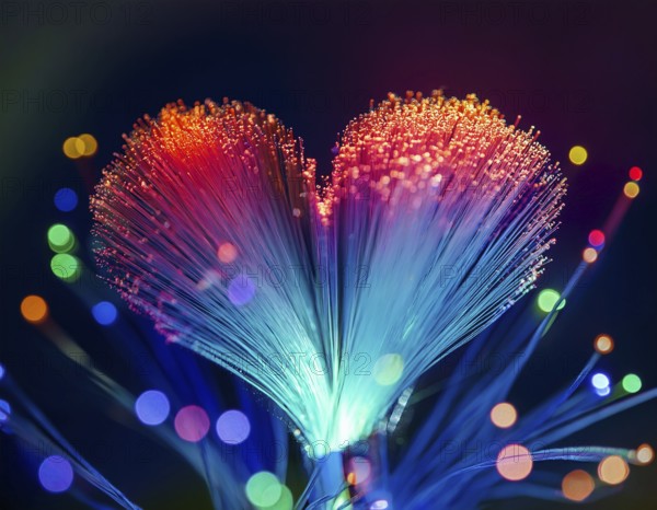 Colorful artistic display featuring vibrant light patterns shaped like a heart, expressing love and creativity through illuminated fibers in a mesmerizing spectrum of rainbow hues, AI generated