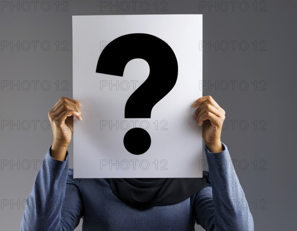 A person concealing their face while holding a question mark sign, symbolizing anonymity, mystery, or inquiry against a minimalistic dark background. Perfect for topics involving curiosity, problem solving, and identity, AI generated