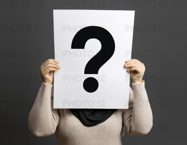 A person concealing their face while holding a question mark sign, symbolizing anonymity, mystery, or inquiry against a minimalistic dark background. Perfect for topics involving curiosity, problem solving, and identity, AI generated