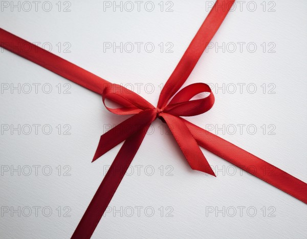 A beautifully wrapped gift box adorned with red satin ribbons forming a bow, contrasting against a linear textured surface, evoking feelings of celebration and elegance, AI generated