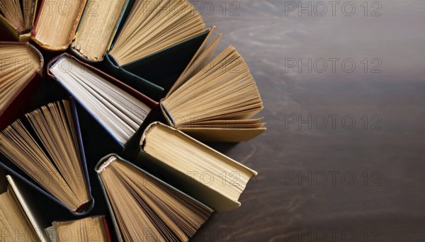 Old books arranged highlighting their historical significance. Neatly arranged representing a collection of wisdom, AI generated