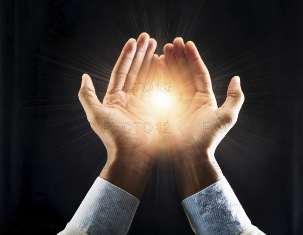 Hand holding light ray in the darkness, hope concept. Light in hands. Freedom and spirituality concept, AI generated