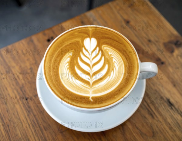 A cozy café latte with heart foam art on wooden table, representing comfort, relaxation, and warm atmosphere, AI generated