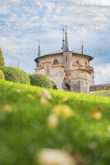 Beautiful castle with pewter towers and manicured lawns under a blue sky, Lichtenstein Castle, Lichtenstein, Swabian Alb, Germany