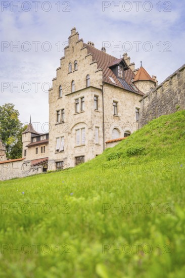Impressive historic building with gabled roof and green meadow, Lichtenstein Castle, Lichtenstein, Swabian Alb, Germany