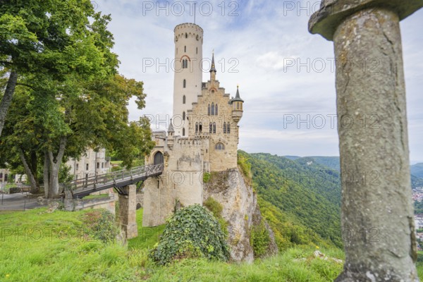 Castle majestically enthroned on a cliff, surrounded by green forest, Lichtenstein Castle, Lichtenstein, Swabian Alb, Germany