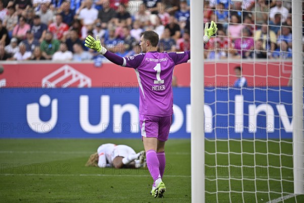 Goalkeeper Manuel Neuer FC Bayern Munich FCB (01) Gesture Gesture Sacha Boey FC Bayern Munich FCB (23) injured Injury Bundesliga football, PreZero Arena, Sinsheim, Baden-Württemberg, Germany