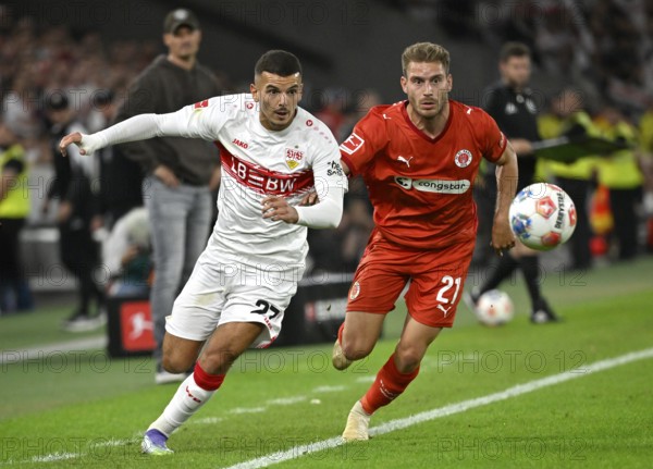 One-on-one, action Badredine Bouanani VfB Stuttgart (27) against Lars Ritzka FC St. Pauli (21) Bundesliga, MHPArena, MHP Arena Stuttgart, Baden-Württemberg, Germany