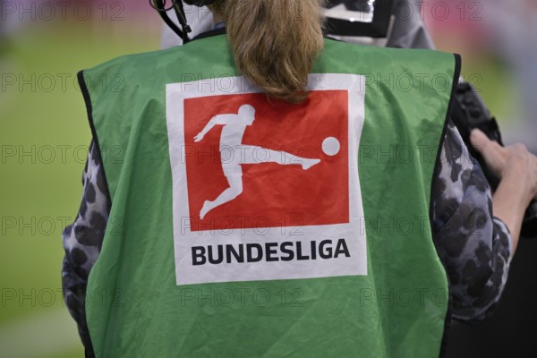 TV camera, camerawoman from behind, bib, logo football Bundesliga, MHPArena, MHP Arena Stuttgart, Baden-Württemberg, Germany