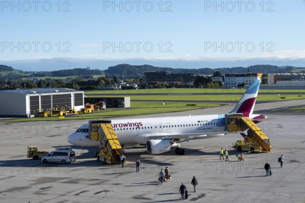 Passengers boarding an Airbus A320-214 of the airline Eurowings at Salzburg Airport, Austria