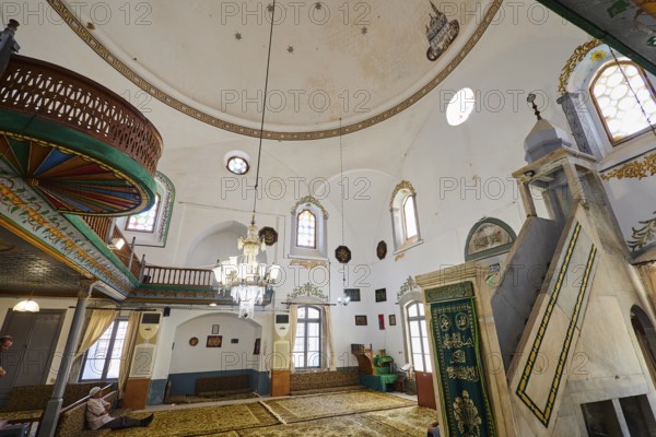Magnificent mosque interior with chandelier and prayer rugs, Ibrahim Pasha Mosque, Old Town, Turkish Quarter, Rhodes Town, Rhodes, Dodecanese, Greek Islands, Greece