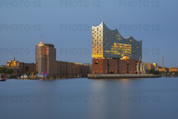 View over the Norderelbe to the Elbphilharmonie in the evening light, long exposure, Hamburg, Germany