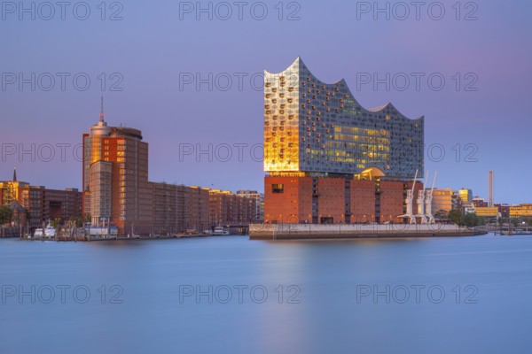 View over the Norderelbe to the Elbphilharmonie in the evening light, long exposure, Hamburg, Germany