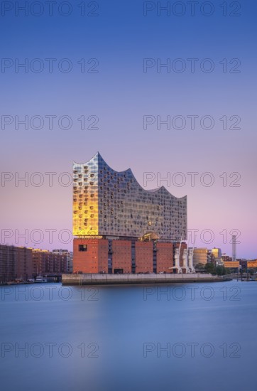 View over the Norderelbe to the Elbphilharmonie in the evening light, long exposure, Hamburg, Germany