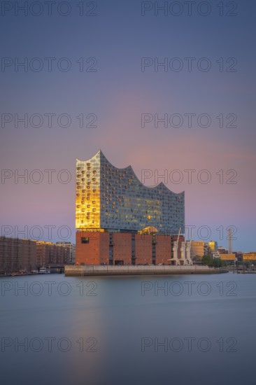 View over the Norderelbe to the Elbphilharmonie in the evening light, long exposure, Hamburg, Germany