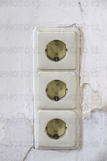 Symbolic image of need for refurbishment, sockets with child protection, Germany