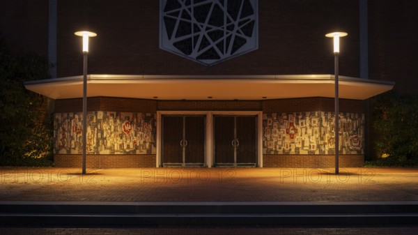 Night shot of the main entrance to the parish church of St Peter and Paul, Neustadt am Rübenberge, Hanover, Lower Saxony, Germany