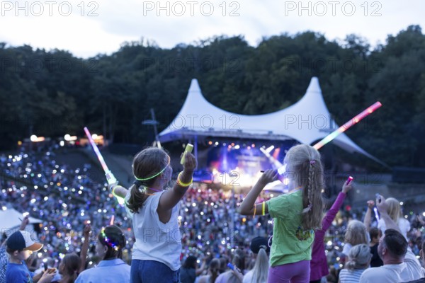 Children with lightsabers at the 25th Berlin Flashlight Concert at the Berlin Waldbühne on 20/09/2025