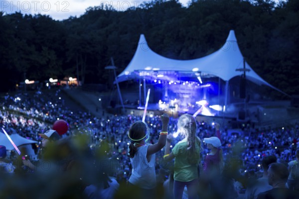 Children with lightsabers at the 25th Berlin Flashlight Concert at the Berlin Waldbühne on 20/09/2025