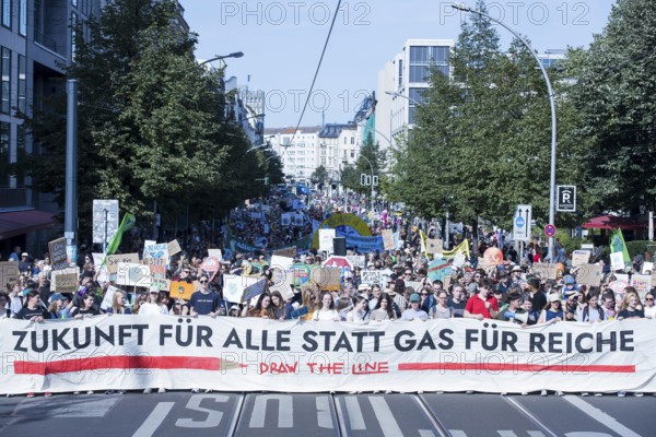 Demonstrators with front banner Future for all instead of gas for the rich on Friedrichstraße at the demonstration on climate protection organised together with Fridays for Future, Berlin, 20.09.2025