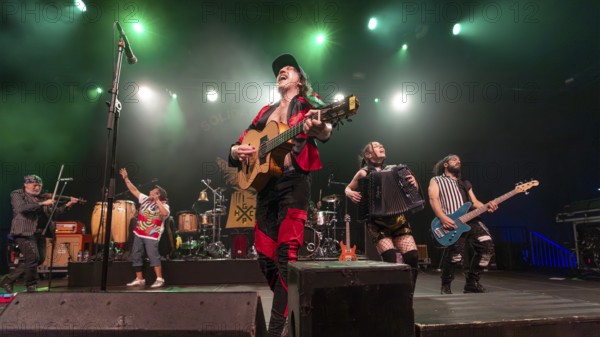 Eugene Hütz, centre, singer and guitarist, Gogol Bordello, folk-punk band, USA, live on Fall 2025 European Tour at Huxleys Neue Welt in Berlin on 19.09.2025 < english> Eugene Hütz, singer and guitarist, folk-punk band, live on Fall 2025 European Tour at Huxleys Neue Welt in Berlin on September 19, 2025