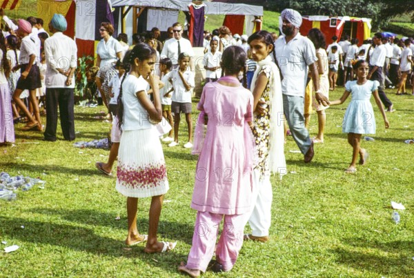 Garden fete community event in the grounds of HMS Terror naval base, Sembawang, Singapore, South East Asia, 1963 - mix of European and Indian people