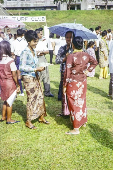 Garden fete community event in the grounds of HMS Terror naval base, Sembawang, Singapore, South East Asia, 1963 - mix of people of different ethnicities