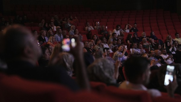 Audience members dance and clap as Turkish singer Coskun Sabah performs during the Türkiye Kültür Yolu Festival, Gaziantep, Gaziantep, Türkiye
